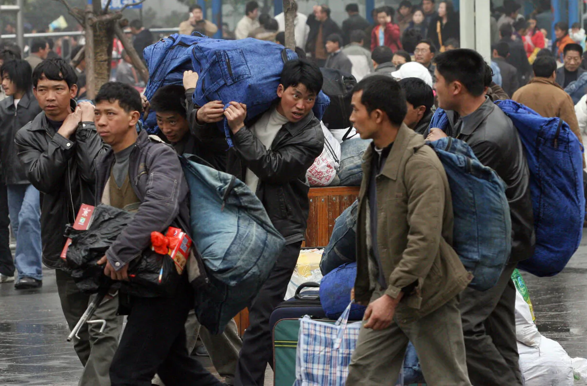 Unable to make a living in China's countryside, many young people go to big cities to perform labor as migrant workers. (MARK RALSTON/AFP via Getty Images)