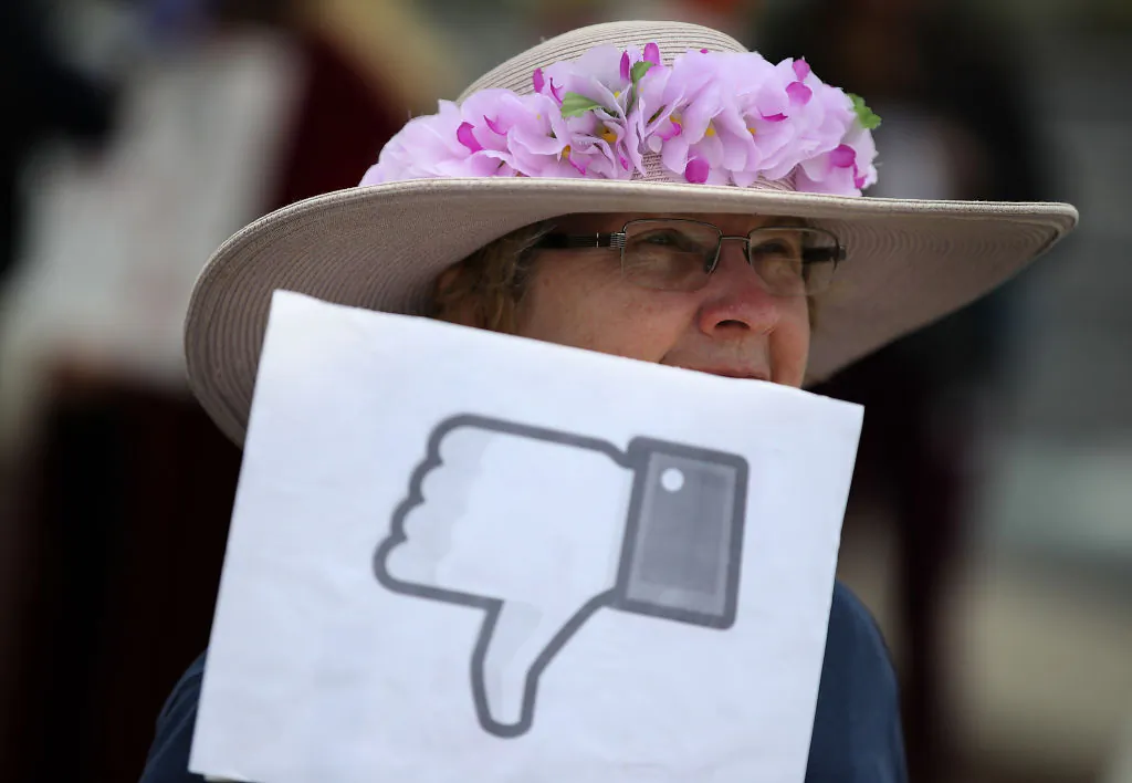 A protester holds a sign during a demonstration calling for better consumer protection and online privacy outside of Facebook headquarters in Menlo Park, Calif., on April 5, 2018. (Justin Sullivan/Getty Images)