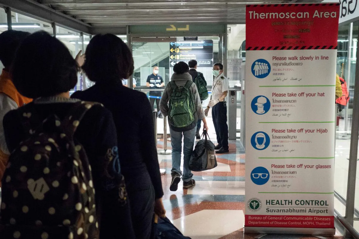 Public Health Officials run thermal scans on passengers arriving from Wuhan, China at Suvarnabumi Airport in Bangkok, Thailand, on Jan. 8, 2020. (Lauren DeCicca/Getty Images)