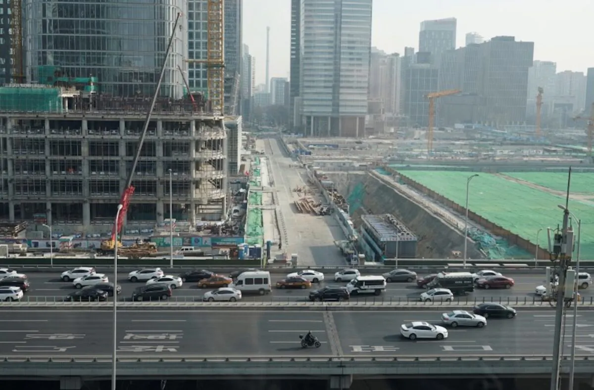 Vehicles drive past construction sites in Beijing's central business area, China on Jan. 17, 2020. (Jason Lee/Reuters)