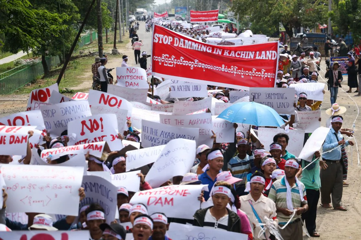 People from Kachin state take part in a protest against the Irrawaddy Myitsone dam project in Waimaw, near the Myitkyina capital of Kachin state, on April 22, 2019. - The controversial dam, a $3.6 billion Beijing-backed project originally designed to supply most of its electricity to China, was halted by Burma in 2011 following protests over environmental and safety concerns. (Zau Ring Hpra/AFP via Getty Images)