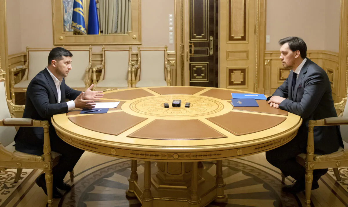 Ukrainian President Volodymyr Zelenskiy, left, talks with Ukraine's Prime Minister Oleksiy Honcharuk in a televised meeting in Kyiv, Ukraine, on Jan. 17, 2020. (Ukrainian Presidential Press Office/AP)