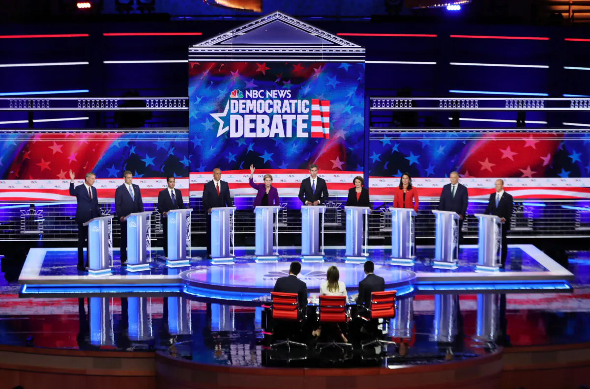 Democratic presidential candidates New York City Mayor Bill De Blasio (L–R), Rep. Tim Ryan (D-Ohio), former housing secretary Julian Castro, Sen. Cory Booker (D-N.J.), Sen. Elizabeth Warren (D-Mass.), former Texas congressman Beto O'Rourke, Sen. Amy Klobuchar (D-Minn.), Rep. Tulsi Gabbard (D-Hawaii), Washington Gov. Jay Inslee, and former Maryland congressman John Delaney take part in the first night of the Democratic presidential debate in Miami, Florida on June 26, 2019.  (Joe Raedle/Getty Images)