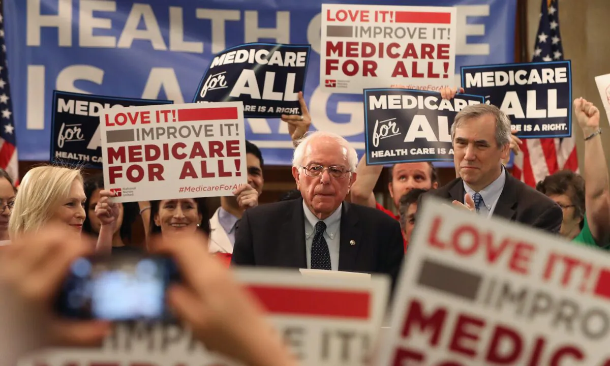 Sen. Bernie Sanders (I-Vt.) speaks while introducing health care legislation titled the "Medicare for All Act of 2019" with Sen. Kirsten Gillibrand (D-N.Y.) and Sen. Jeff Merkley (D-Ore.), during a news conference on Capitol Hill in Washington on April 9, 2019.  Mark Wilson/Getty Images