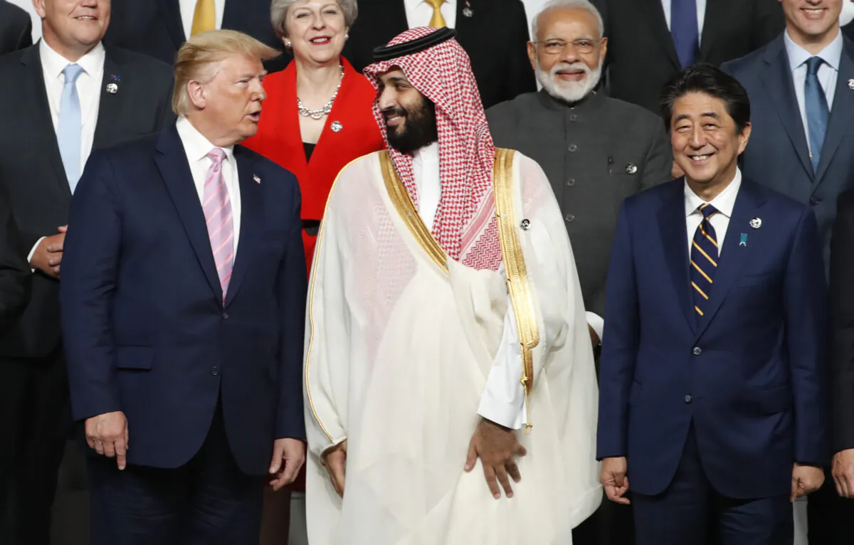 President Donald Trump (L) speaks with Saudi Arabia's Crown Prince Mohammed bin Salman during a family photo session at the G-20 Summit in Osaka on June 28, 2019. (KIM KYUNG-HOON/AFP via Getty Images)