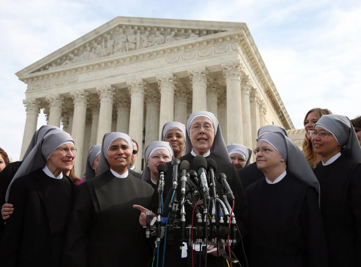 Mother Loraine Marie Maguire, (C), of the Little Sisters of the Poor, speaks to the media after arguments at the U.S. Supreme Court in Washington on March 23, 2016. (Mark Wilson/Getty Images)