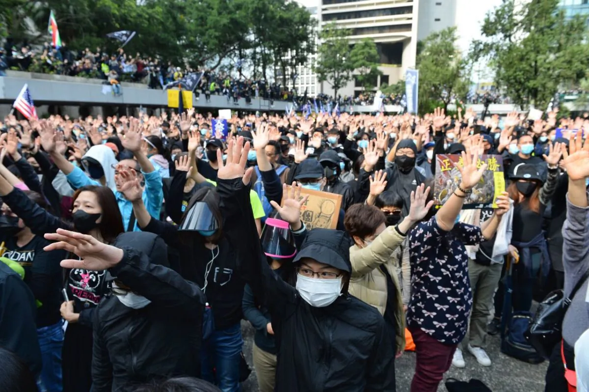 Protesters hold up their hands in a sign to voice their five demands at a rally in Chater Garden, Hong Kong, on Jan. 19, 2020. (Sun Pi-lung/The Epoch Times)