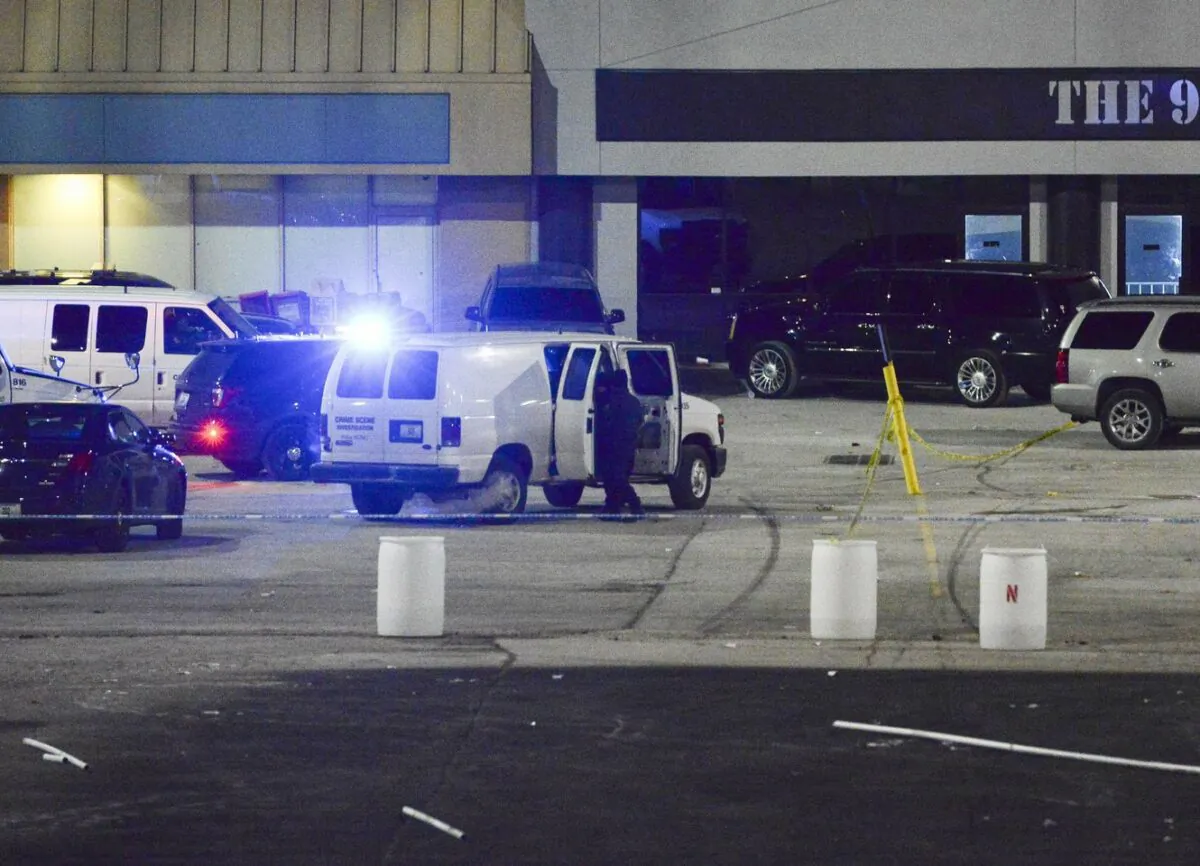 Kansas City, Mo., police crime scene investigators gather evidence at the scene of a shooting in Kansas City, Mo., on Jan. 20, 2020. (Luke Nozicka/The Kansas City Star via AP)