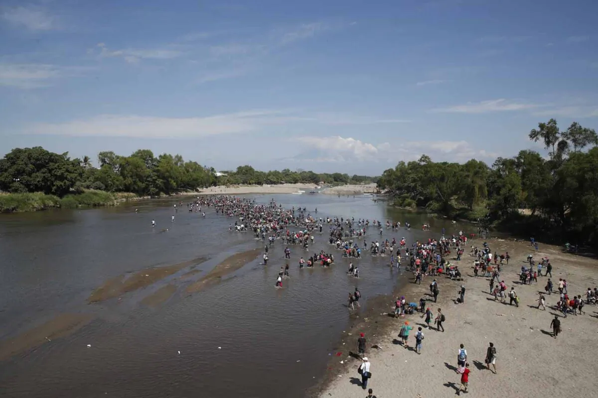Central American migrants cross the Suchiate River by foot from Tecun Uman, Guatemala, to Mexico, on Jan. 20, 2020. (Moises Castillo/(AP Photo)