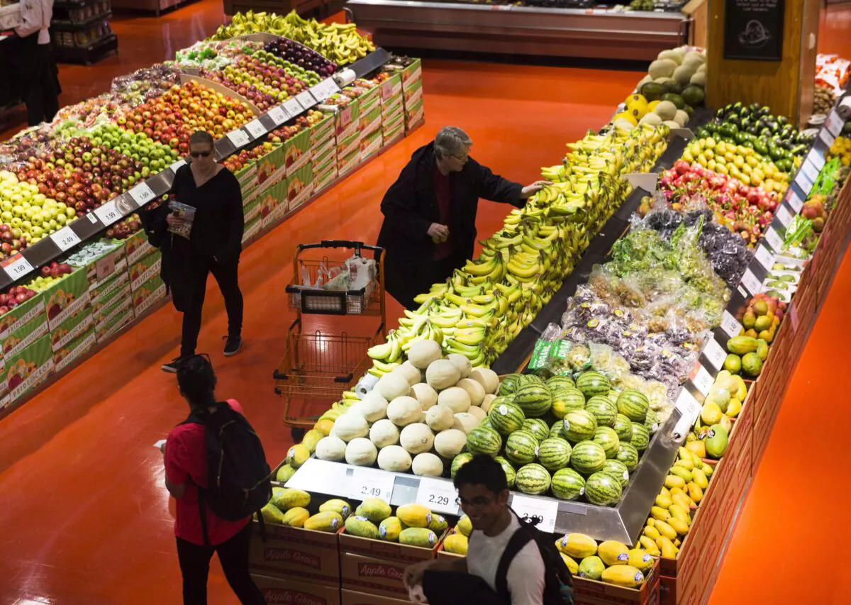 People shop at a Loblaws store in Toronto on May 3, 2018. Food, patriotism, and marketing will soon converge in a “Buy Canadian Promotion Campaign” sponsored by taxpayers. (The Canadian Press/Nathan Denette)
