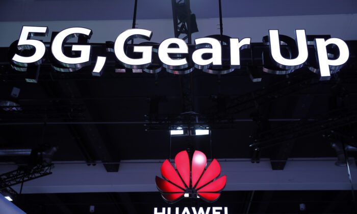 Huawei and 5G signs on display during the 10th Global Mobile Broadband Forum hosted by Chinese tech giant Huawei in Zurich, Switzerland, on Oct. 15, 2019. (Stefan Wermuth/AFP via Getty Images)
