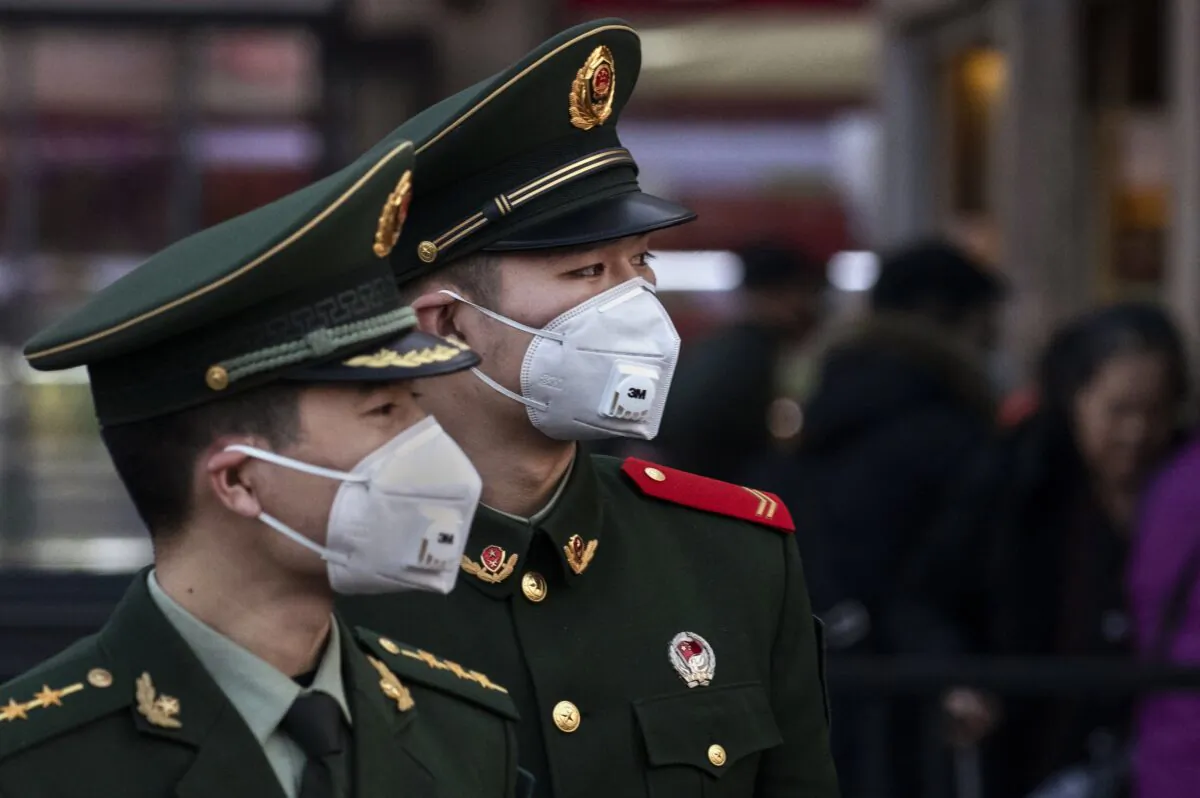 Chinese police officers wear protective masks at Beijing Station in Beijing, China on Jan. 22, 2020. (Kevin Frayer/Getty Images)