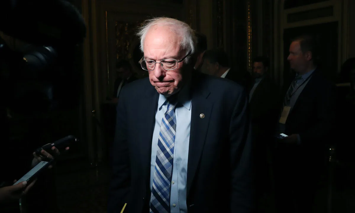 Sen. Bernie Sanders (I-Vt.) talks to reporters at the U.S. Capitol in Washington on Jan. 21, 2020. Mark Wilson/Getty Images