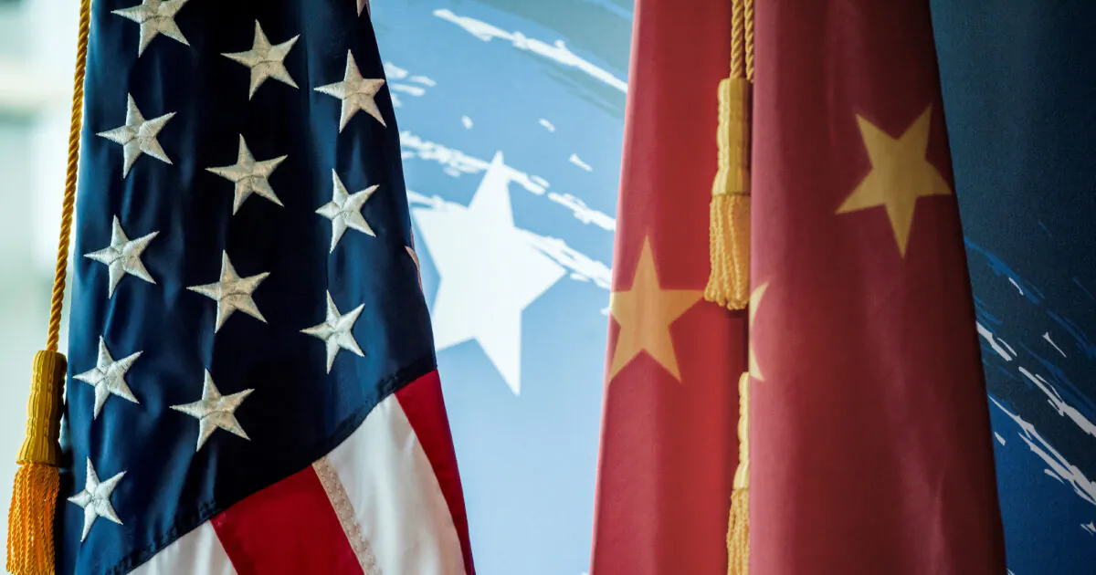 The Chinese and U.S. national flags are seen during a promotional event in Beijing on Jun. 30, 2017. (Fred Dufour/AFP via Getty Images)