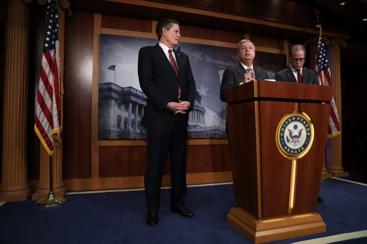 Sen. Lindsey Graham (R-S.C.) speaks as Sen. Steve Daines (R-Mont.), left, and Sen. Mike Braun (R-Ind.) listen during a news conference on the Senate impeachment trial against President Donald Trump at the U.S. Capitol on 22, 2020. (Alex Wong/Getty Images)