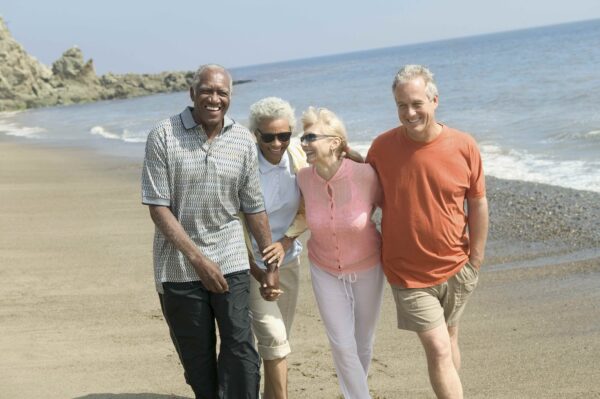 happy couples on beach