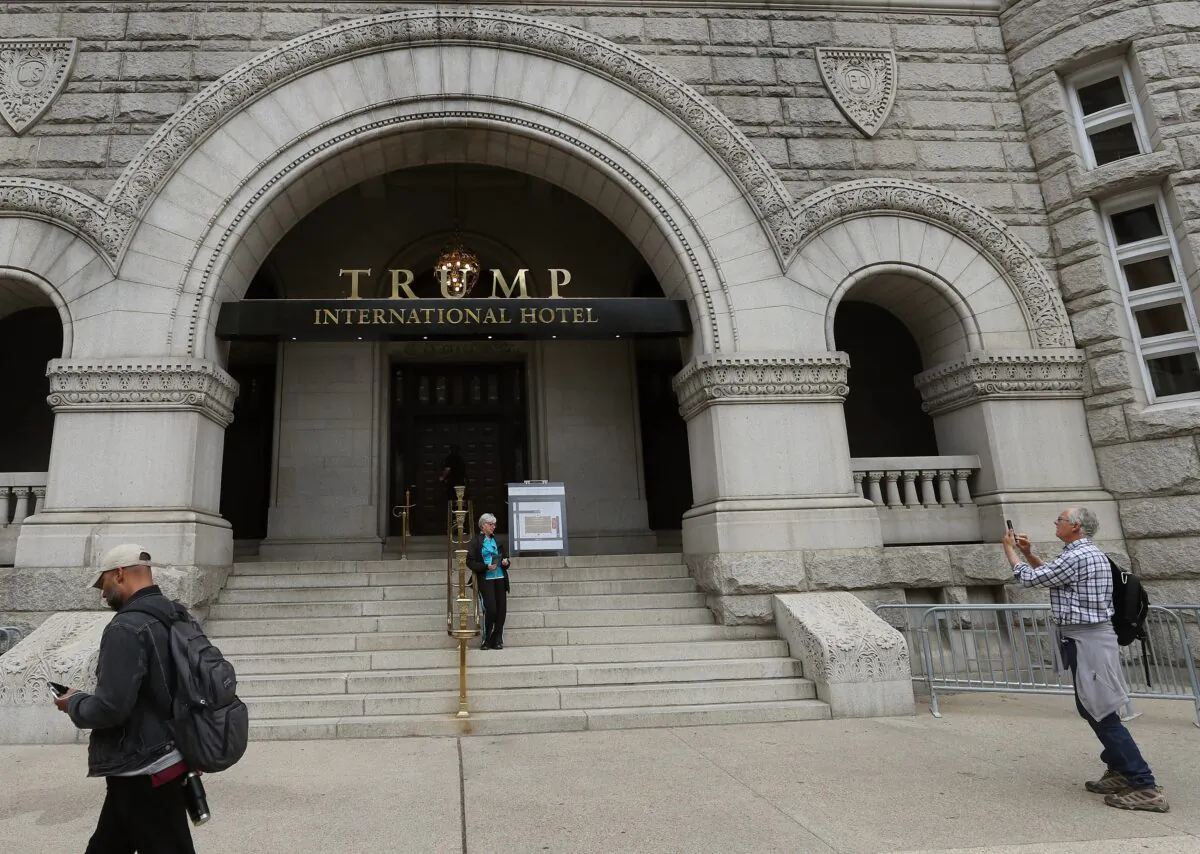 People walk past the Trump International Hotel on Pennsylvania Ave. in Washington on Oct. 25, 2019. (Mark Wilson/Getty Images)