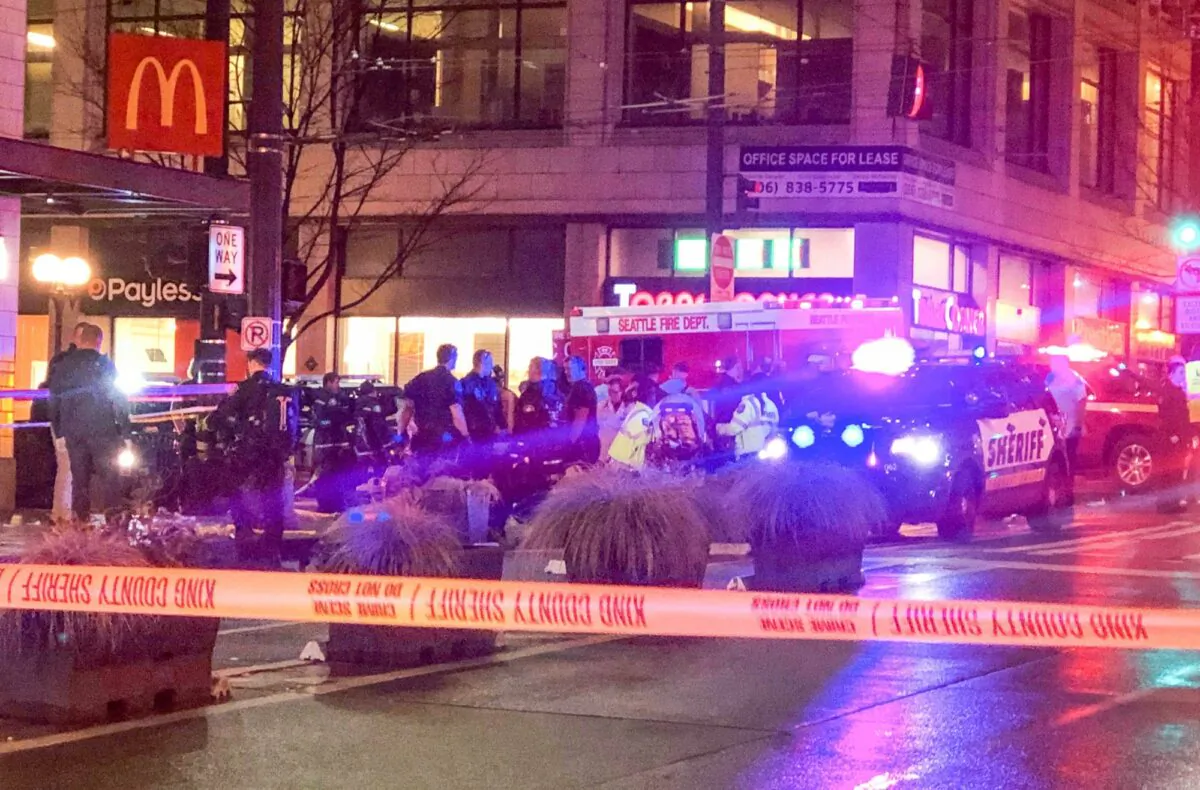 Police work the scene of a shooting on Third Avenue and Pine Street on Jan. 22, 2020, in Seattle. (Amanda Snyder/The Seattle Times via AP)