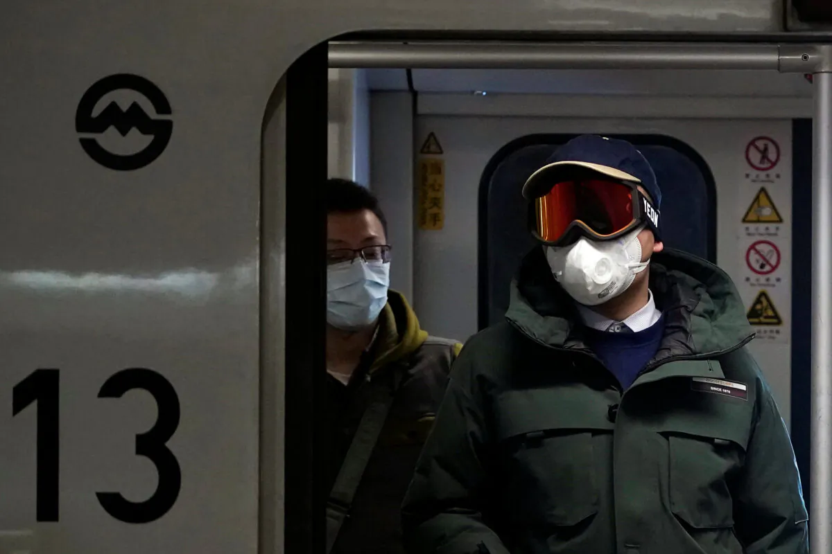 People wearing masks are seen on a subway in Shanghai, China, on Jan. 23, 2020. (Aly Song/Reuters)