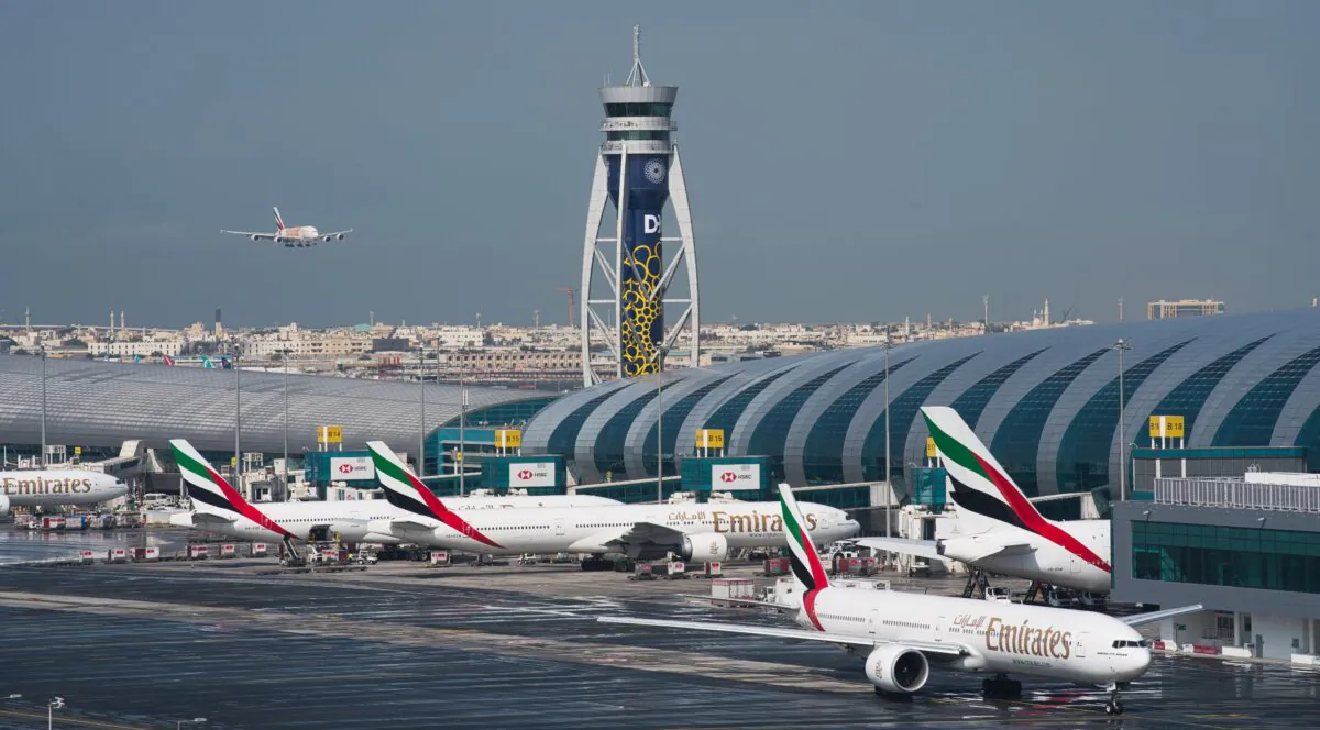 An Emirates jetliner comes in for landing at Dubai International Airport in Dubai, United Arab Emirates on Dec. 11, 2019. Dubai International Airport, the world's busiest for international travel, said on Jan. 23, 2020, that it is taking special precautions to screen the droves of Chinese tourists expected for the Lunar New Year holiday after the outbreak of a pneumonia-like virus that has led to China's lockdown of the entire city of Wuhan. (Jon Gambrell/AP)