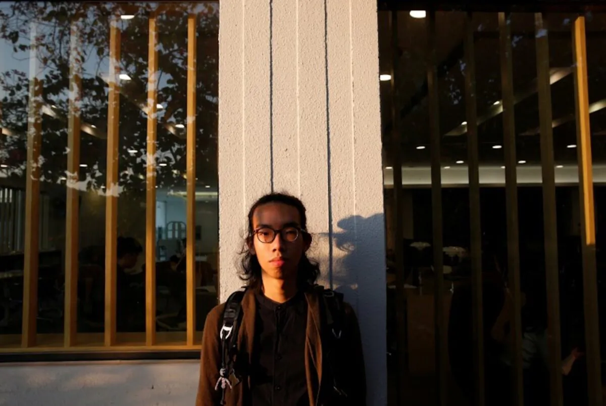 Derek Tai poses for photo at the campus of Chinese University of Hong Kong in Hong Kong, China, on Jan. 14, 2020. (Tyrone Siu/Reuters)