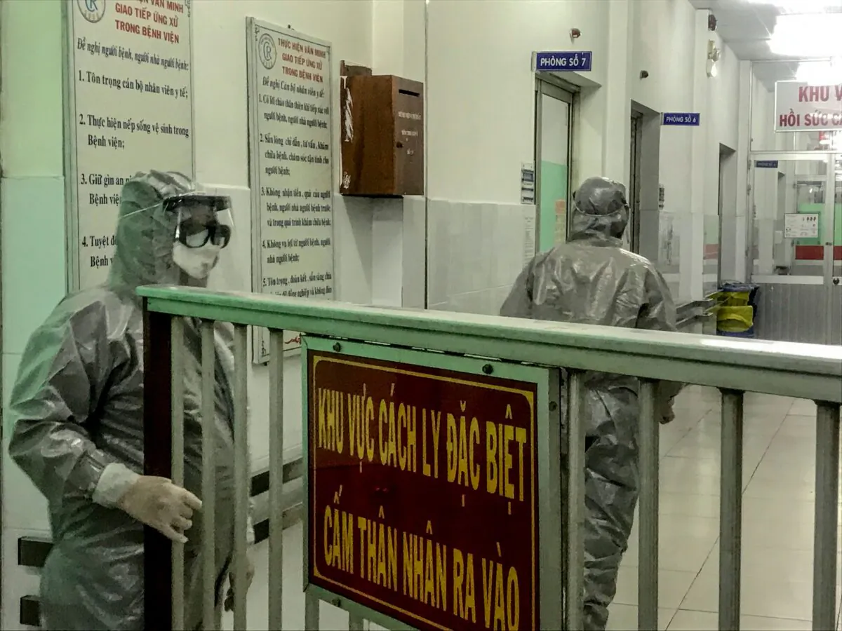 Medical workers enter an isolation area to visit the first two cases of the new coronavirus infection, in Cho Ray hospital in Ho Chi Minh City on Jan. 23, 2020. (Bach Duong/AFP via Getty Images)