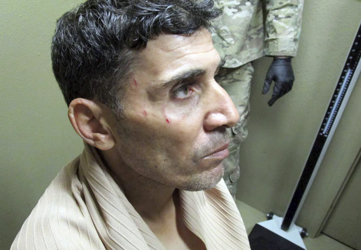 This undated image provided by the FBI shows Mustafa al-Imam after his capture in October 2017. (FBI via AP)