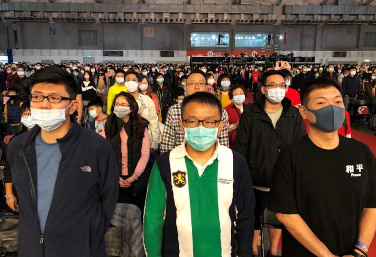 Foxconn employees wearing masks attend the company's year-end gala in Taipei, Taiwan on Jan. 22, 2020. (Yimou Lee/Reuters)