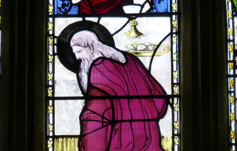In the Church of St. John the Baptist, Yeovil, England, one stained glass window depicts the patron saint of woke with a black halo. (Public Domain)