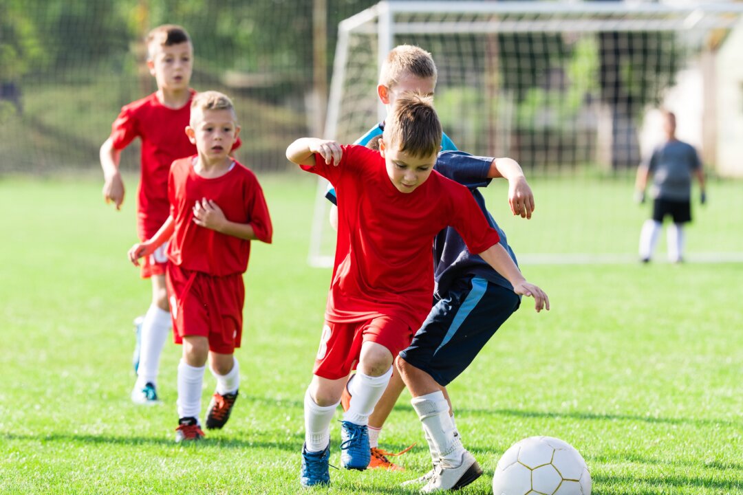 Kids burn off an average of 170 calories playing team sports but consume an average of 213 from sugary drinks and snacks handed out by parents after the game. (Fotokostic/Shutterstock)