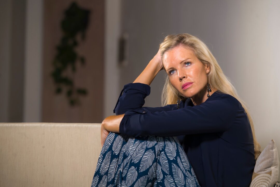 That midlife feeling of pervasive disappointment or malaise is normal and promises brighter feelings ahead, find researchers. (TheVisualsYouNeed/Shutterstock)