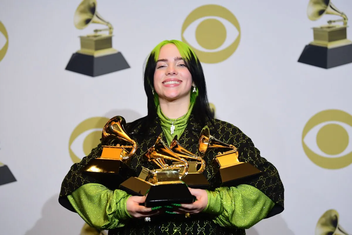 U.S. singer-songwriter Billie Eilish poses in the press room with the awards for Album Of The Year, Record Of The Year, Best New Artist, Song Of The Year and Best Pop Vocal Album during the 62nd Annual Grammy Awards in Los Angeles on Jan. 26, 2020. (FREDERIC J. BROWN/AFP via Getty Images)
