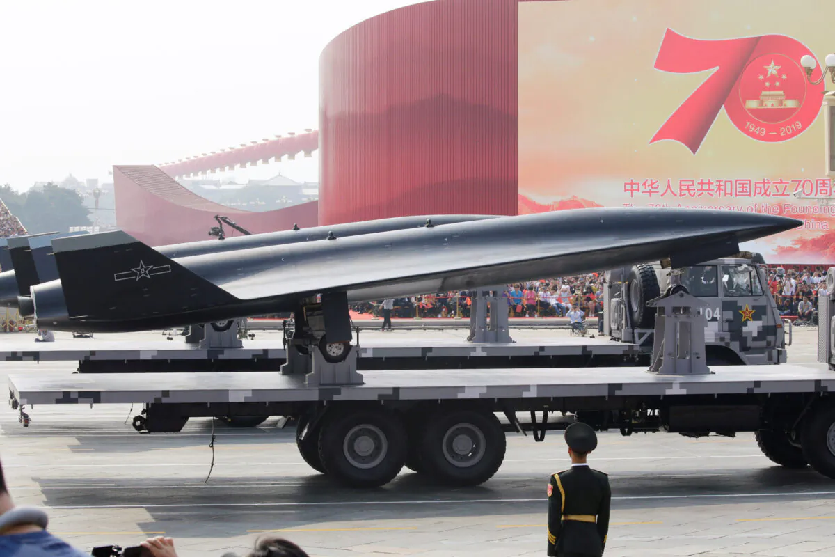 A military vehicle carrying a WZ-8 supersonic reconnaissance drone travels past Tiananmen Square in Beijing during a military parade marking the 70th founding anniversary of China's communist regime, on Oct. 1, 2019. (Jason Lee/Reuters)