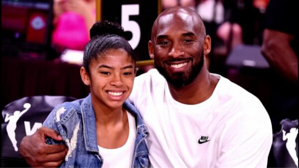 Kobe Bryant adjusts his jersey