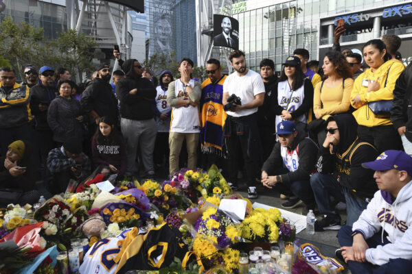 People gather at a memorial for Kobe Bryant