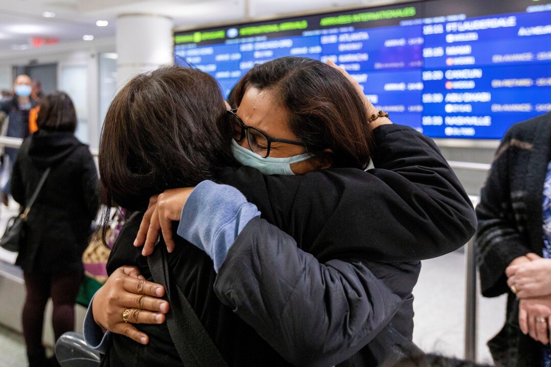 There was much heartache for bi-national families during COVID-19 travel restrictions. (Carlos Osorio/Reuters)