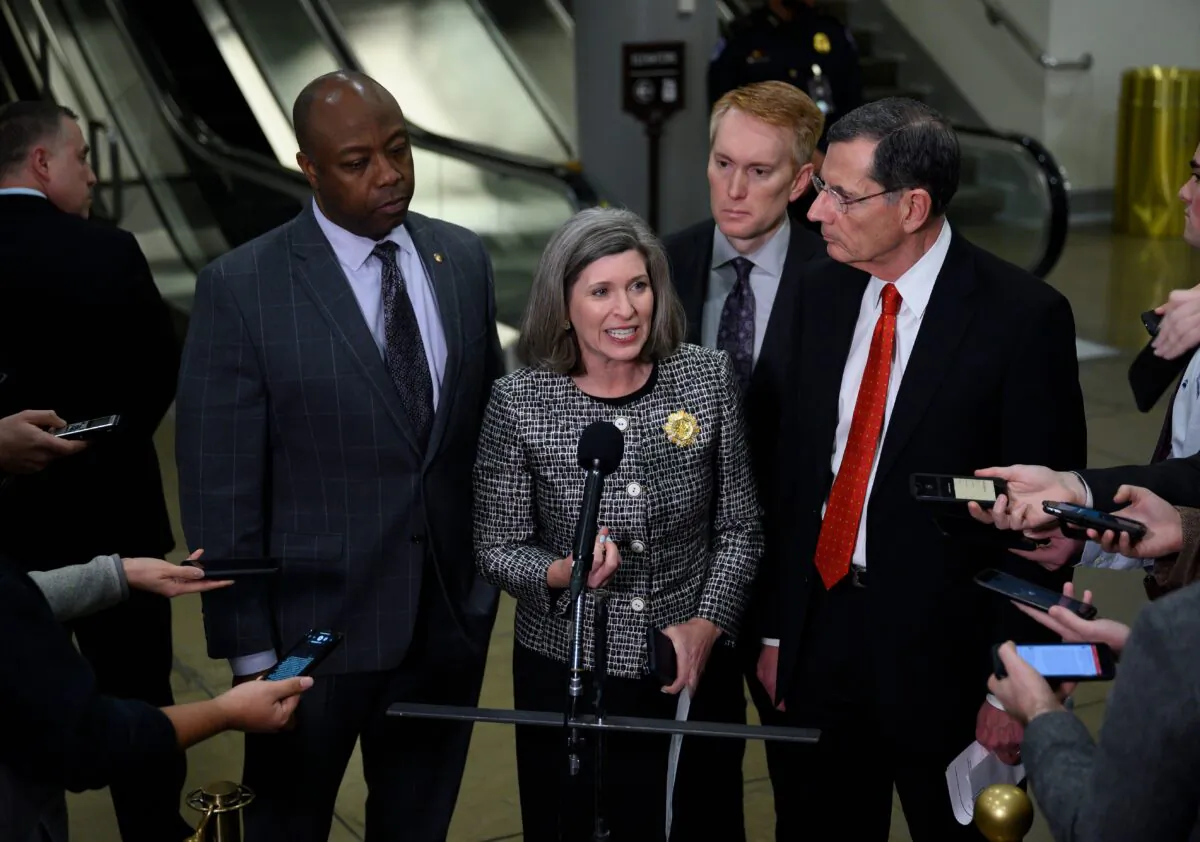 Sen. Joni Ernst (R-Iowa), center, speaks as Sens. Tim Scott (R-S.C.), left, James Lankford (R-Okla.), second from right, and John Barrasso (R-Okla.) listen during a press conference during a break in the Senate impeachment trial of President Donald Trump at the U.S. Capitol in Washington on Jan. 23, 2020. (Andrew Caballero-Reynolds/AFP via Getty Images)