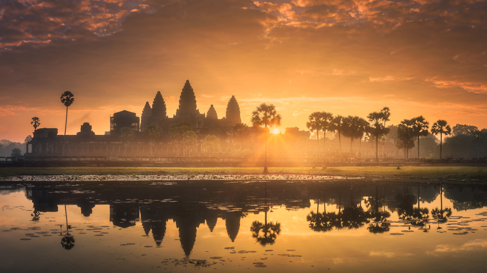The temples within Angkor Archeological Park were built from the 9th to the 13th century. Sunrise is a popular time to catch Angkor Wat's reflection. (Shutterstock)