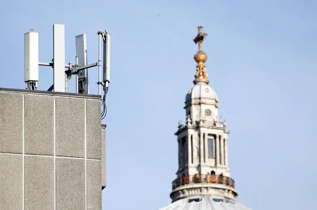 Mobile network phone masts are visible in front of St Paul's Cathedral in London, England on Jan. 28, 2020. (AP Photo/Alastair Grant)