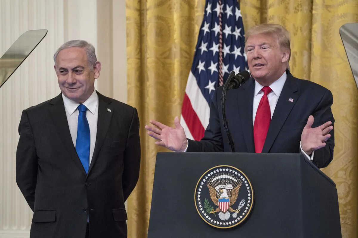 U.S. President Donald Trump and Israeli Prime Minister Benjamin Netanyahu participate in a joint statement in the East Room of the White House on Jan. 28, 2020. (Sarah Silbiger/Getty Images)