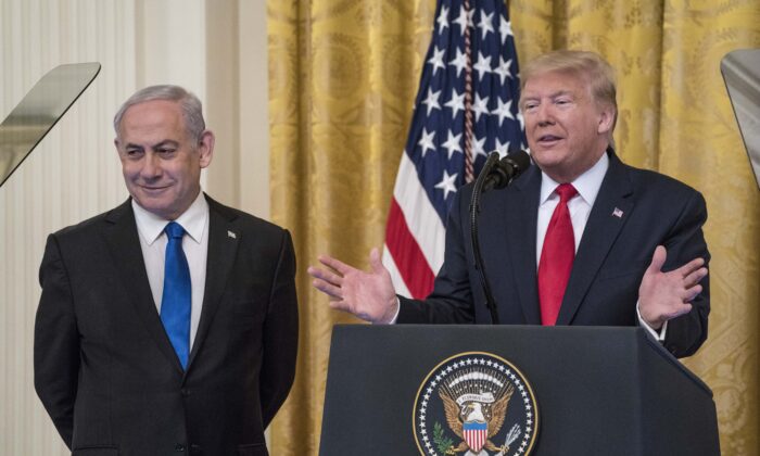 U.S. President Donald Trump and Israeli Prime Minister Benjamin Netanyahu participate in a joint statement in the East Room of the White House on Jan. 28, 2020. (Sarah Silbiger/Getty Images)