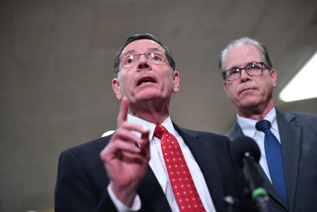 Sen. John Barrasso (R-Wyo.) speaks to reporters as Sen. Mike Braun (R-Ind.) listens during a recess in the impeachment trial of President Donald Trump at the U.S. Capitol in Washington on Jan. 27, 2020. (Mandel Ngan/AFP via Getty Images)