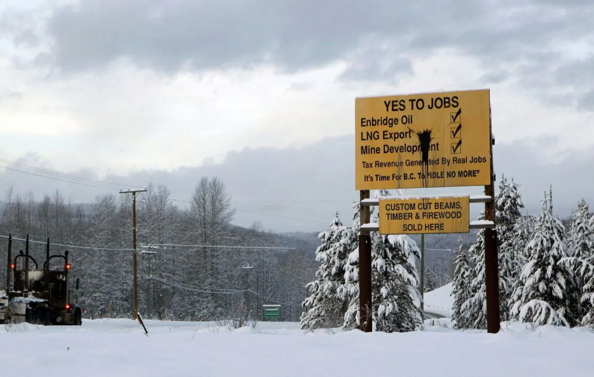 Signage in favour of resource development is seen along Yellowhead Highway near Telkwa in northern British Columbia on Jan. 10, 2019. (The Canadian Press/Chad Hipolito)