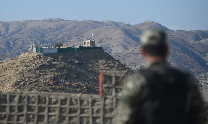 Pakistani army soldier stand guard on a border terminal in Ghulam Khan, a town in North Waziristan, on the border between Pakistan and Afghanistan, on Jan. 27, 2019. (Farooq Naeem/AFP via Getty Images)
