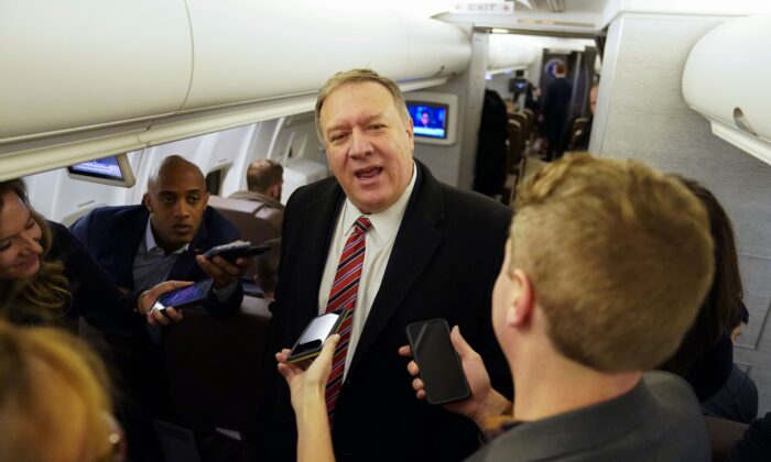 Secretary of State Mike Pompeo speaks to reporters aboard his plane en route to London, Britain on Jan. 29, 2020. (KEVIN LAMARQUE/POOL/AFP via Getty Images)
