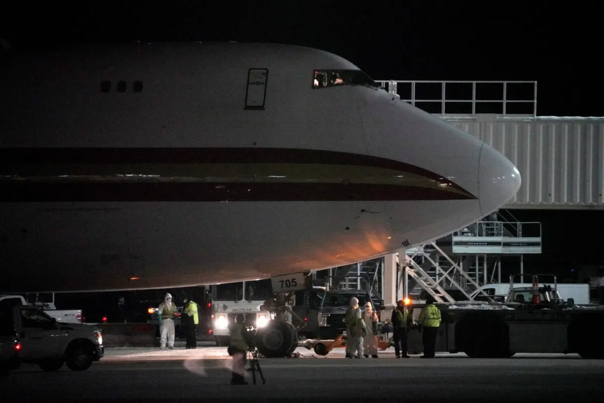 An aircraft chartered by the U.S. State Department to evacuate government employees and other Americans from the novel coronavirus threat in the Chinese city of Wuhan, is seen on the tarmac after arriving at a closed terminal at Ted Stevens Anchorage International Airport in Anchorage, Alaska on Jan. 28, 2020. (Kerry Tasker/Reuters)