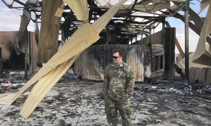 A U.S. soldier stands at a site of Iranian bombing, in Ain al-Asad air base, Anbar, Iraq, on Jan. 13, 2020. (Qassim Abdul-Zahra/AP Photo)
