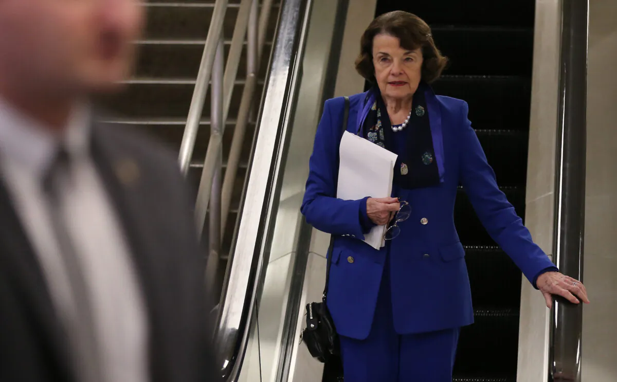 Sen. Dianne Feinstein (D-Calif.) descends an escalator at the U.S. Capitol after the Senate impeachment trial adjourned for the day in Washington on Jan. 28, 2020. (Mario Tama/Getty Images)