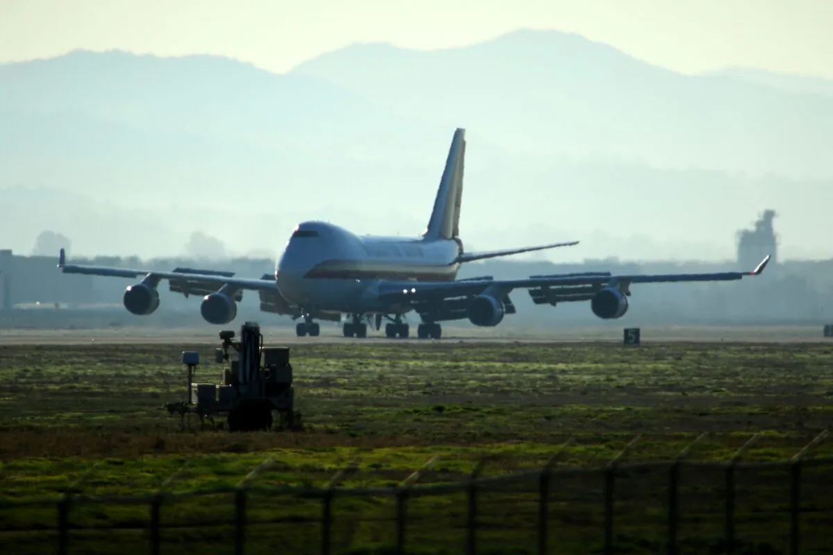 A plane lands at March Air Reserve Base in Riverside, California with Americans evacuted from Wuhan, China, on Jan. 29, 2020. (Matt Hartman/AFP via Getty Images)
