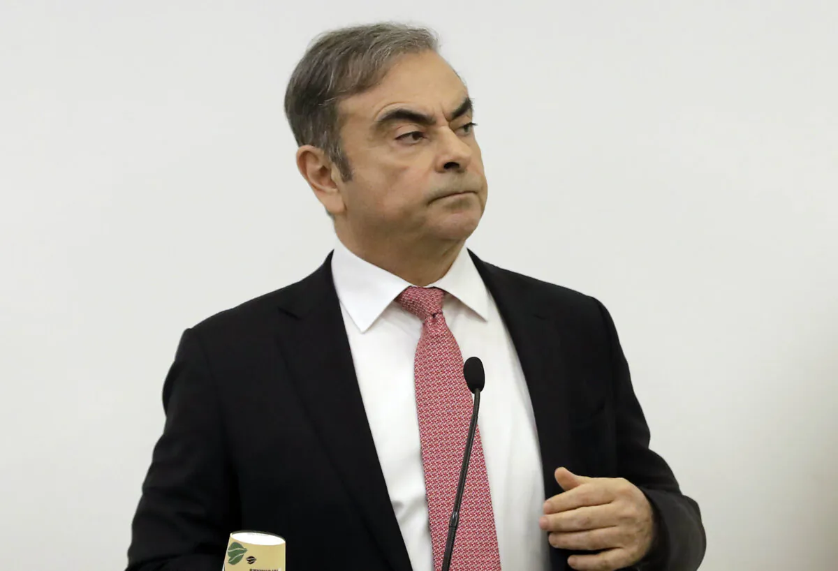 Former Renault-Nissan boss Carlos Ghosn addresses a large crowd of journalists on his reasons for dodging trial in Japan, where he is accused of financial misconduct, at the Lebanese Press Syndicate in Beirut on Jan. 8, 2020. (Photo by Joseph Eid/AFP via Getty Images)